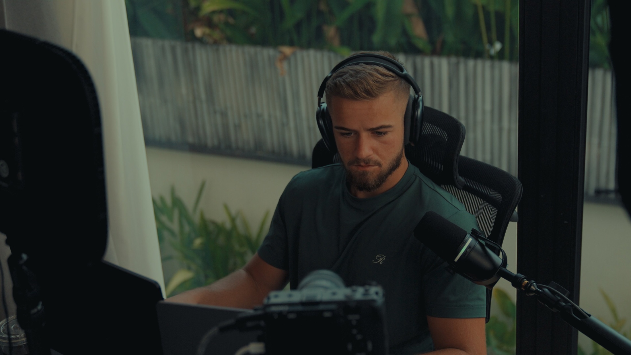 Cameron England recording a podcast